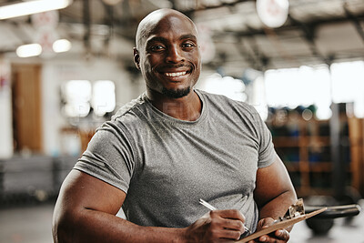 Buy stock photo Gym, documents or black man writing on clipboard for membership, sign up or checklist for sport health or workout. Wellness coach, fitness or happy personal trainer, paper for exercise schedule