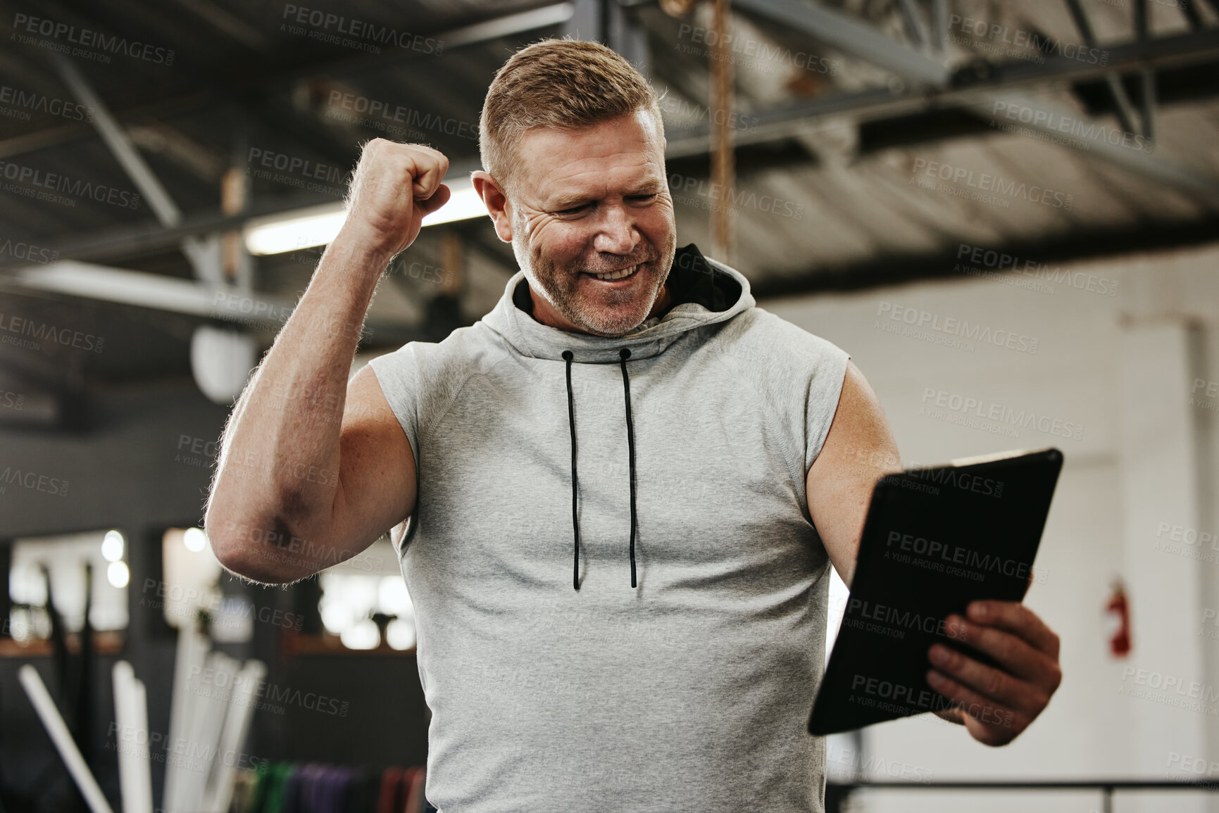 Buy stock photo Gym, workout and happy personal trainer with clipboard in celebration after wellness training. Fitness, health and man coach reading checklist to celebrate win, achievement or victory at sport studio