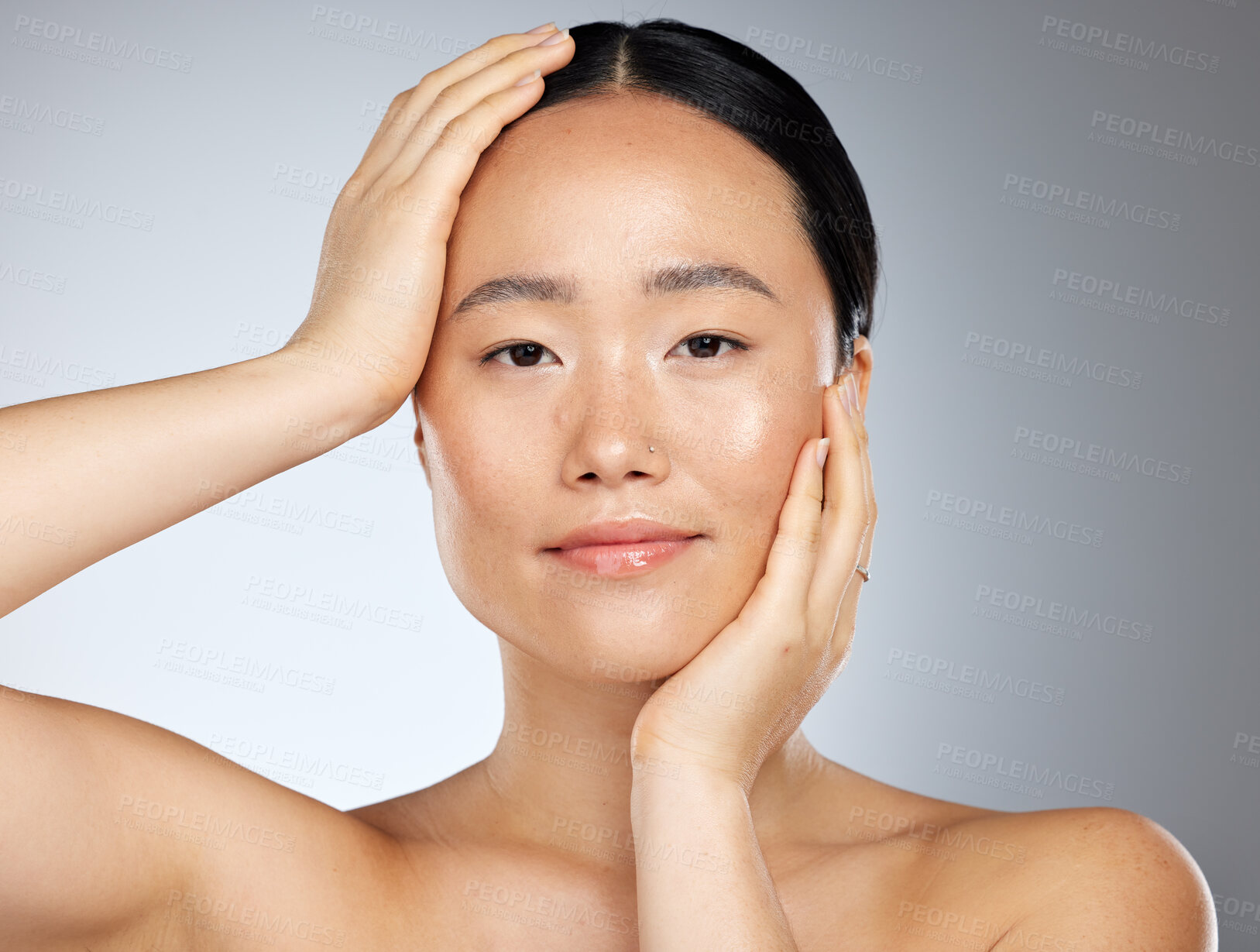 Buy stock photo Skincare, beauty and woman with facial makeup against a grey mockup studio background. Face portrait of a happy, relax and calm Asian model with peace from cosmetics, dermatology and skin wellness