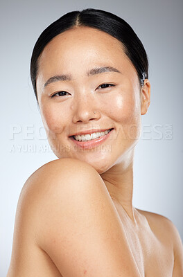 Buy stock photo Beauty, asian and skincare with portrait of woman and smile for spa, cosmetics and clean wellness. Happy, makeup and facial treatment with girl for luxury, health and model in gray background studio