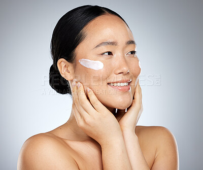 Buy stock photo Asian woman, skincare cream and face makeup, sunscreen beauty product and luxury cosmetics wellness on studio background. Happy Japanese model, facial spf lotion and natural aesthetic dermatology 