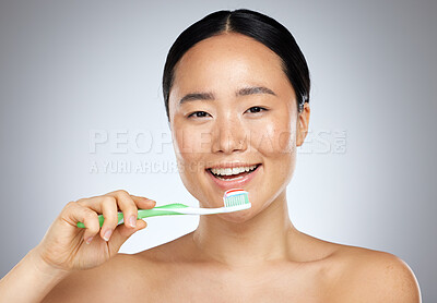 Buy stock photo Brushing teeth, asian woman beauty and dental wellness, health and cleaning cosmetics on studio background. Happy young Japanese model face portrait, toothpaste on toothbrush and healthy mouth breath
