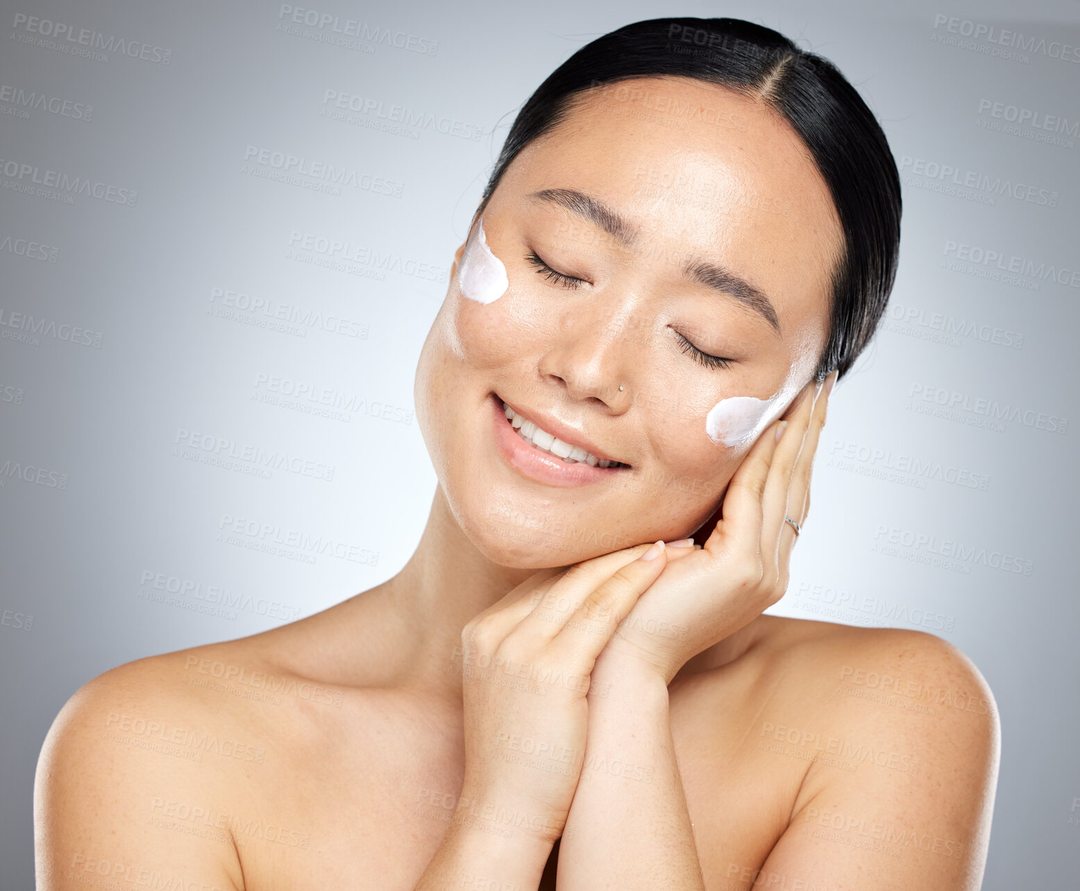 Buy stock photo Asian woman, cream and skincare for wellness, natural beauty and healthy with cosmetics in studio background. Moisturizer, young girl and confident lady with lotion, organic facial and smooth skin.