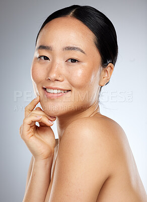 Buy stock photo Beauty, asian and skincare with portrait of woman for facial, wellness and cosmetics. Smile, health and luxury with girl in gray background studio for natural makeup, spa and model face product 