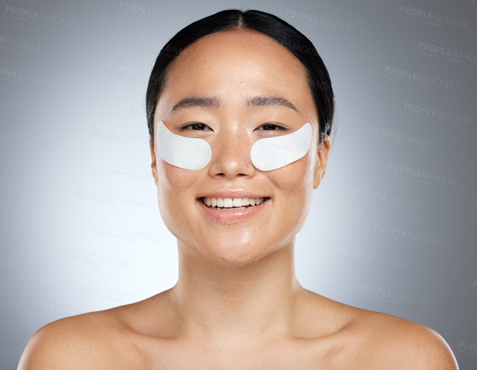 Buy stock photo Beauty, asian and portrait of woman with patch for eye collagen skincare with happy smile. Satisfied girl model with face cosmetic treatment for skin anti aging with grey studio mockup.

