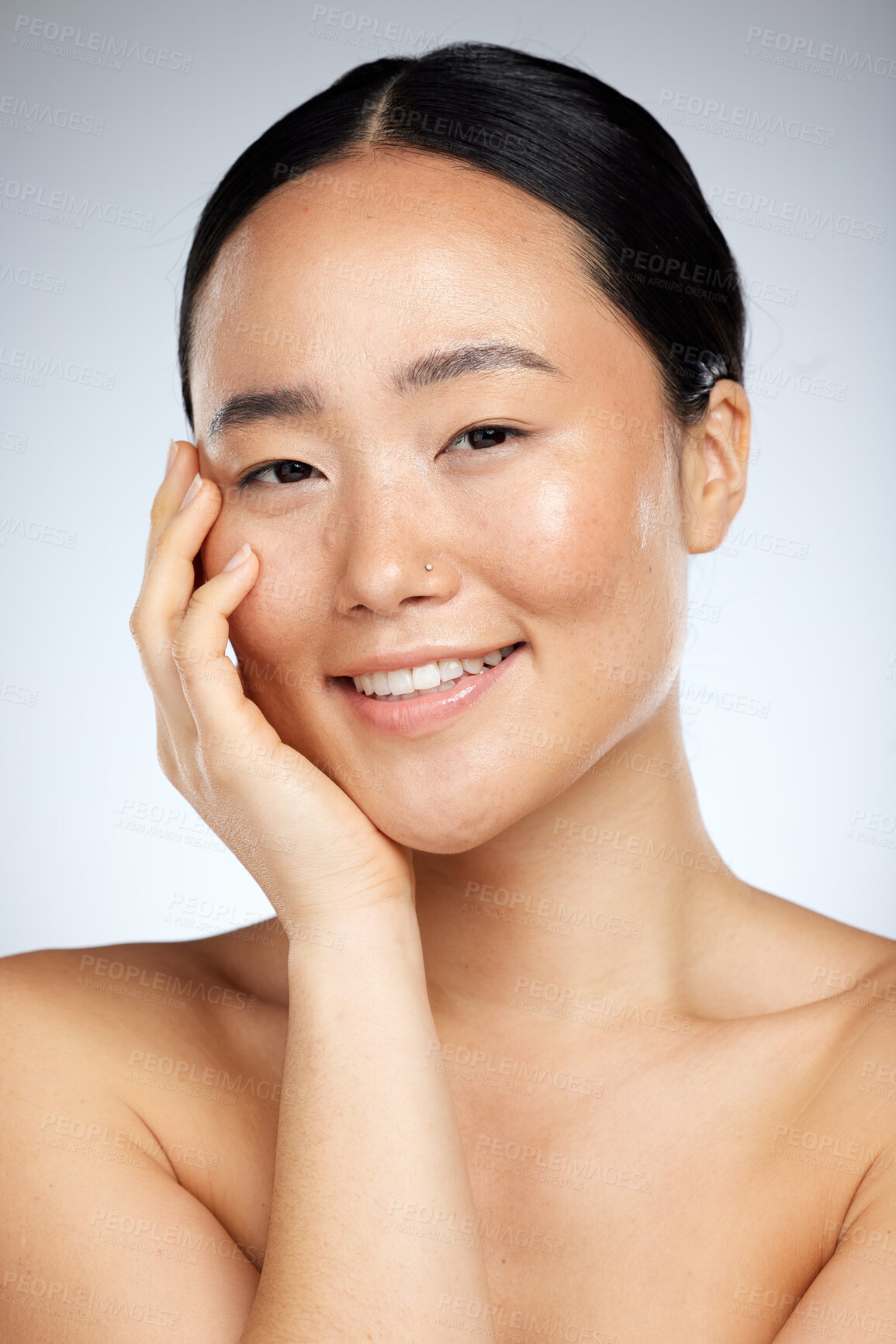 Buy stock photo Beauty, skincare and face of woman in studio for facial, grooming and cleaning against a grey background. Portrait, face and asian wellness model smile, relax and happy with cosmetics and dermatology