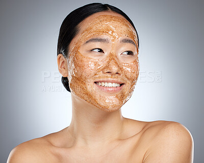 Buy stock photo Exfoliate face mask for beauty skincare, natural product for healthy skin and clean cosmetic wellness for body against grey mockup studio background. Happy, smile and healthcare on Asian woman model 