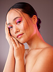 Neon skincare, beauty and woman with makeup on face against a grey studio background. Portrait of calm, relax and Asian model with creative, young and facial cosmetics for art, wellness and happiness