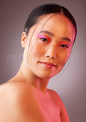 Buy stock photo Futuristic makeup, asian beauty and woman in studio portrait with neon light for cosmetics product advertising. Japanese or Korea girl model headshot or face with vaporwave future cosmetic mock up