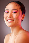 Face, makeup and beauty with a model asian woman in studio on a gray background to promote a cosmetic product. Luxury, wellness and portrait with an attractive young female posing for cosmetics