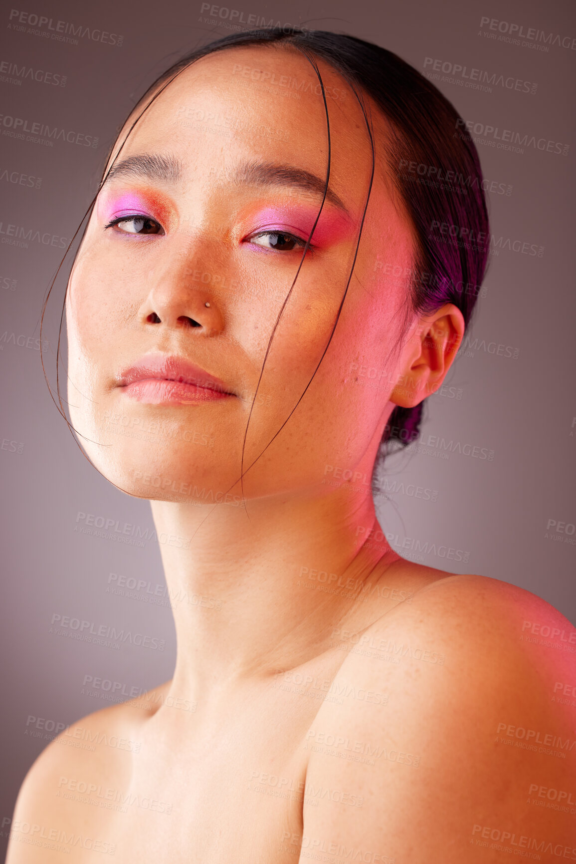 Buy stock photo Woman with makeup, pink eyes shadow and luxury cosmetics product for beauty, skincare and creative facial design. Aesthetic, glamour and face of Asian girl with neon lights, glowing skin or self care