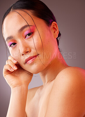 Buy stock photo Portrait, Asian woman and makeup for natural beauty, wellness and happy with studio background for skincare. Cosmetics, young girl and body care for organic facial, smooth skin and creative neon face