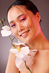 Beauty, flowers and makeup, portrait of woman from Japan with eyeshadow and smile on face. Nature, luxury spa and natural skincare product ingredients for facial and makeover on beautiful asian girl.