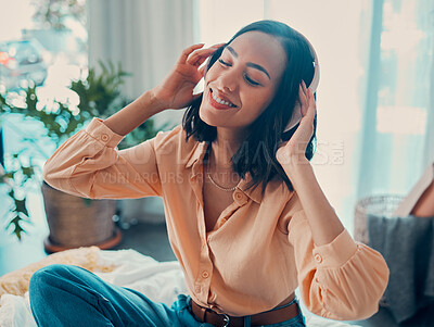 Buy stock photo Headphones, relax music and happy woman on bed in home enjoying her favorite album. Freedom, smile and carefree female from Brazil having fun streaming audio, radio or podcast sound track on headset.