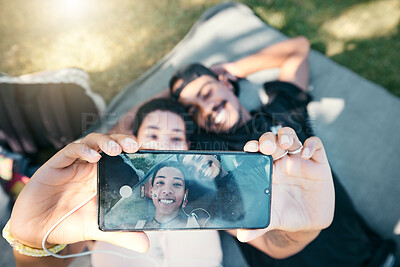 Buy stock photo Couple in park, phone selfie and lying on blanket to relax on romantic picnic and spending quality time together. Love, romance and man and woman on grass with picture on smartphone screen and smile.