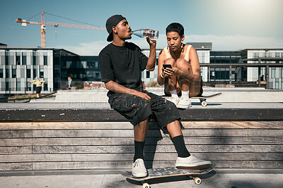 Skateboard, water and friends with a black man and woman skater outdoor in the city for fun or recreation together. Couple, skating and summer with a male and female in an urban town to skate