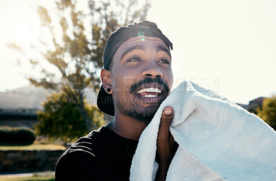 Buy stock photo Black man, face and towel while outdoor for fitness, health and exercise in park, street or town. Man, young and gen z in summer, sunshine or trees with cloth for dry, sweat or skin in Los Angeles