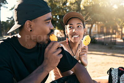 Buy stock photo Ice cream, sweet and couple in city with food during travel, adventure and holiday in street. Happy, young and relax man and woman eating ice dessert on a date during vacation in a park during summer