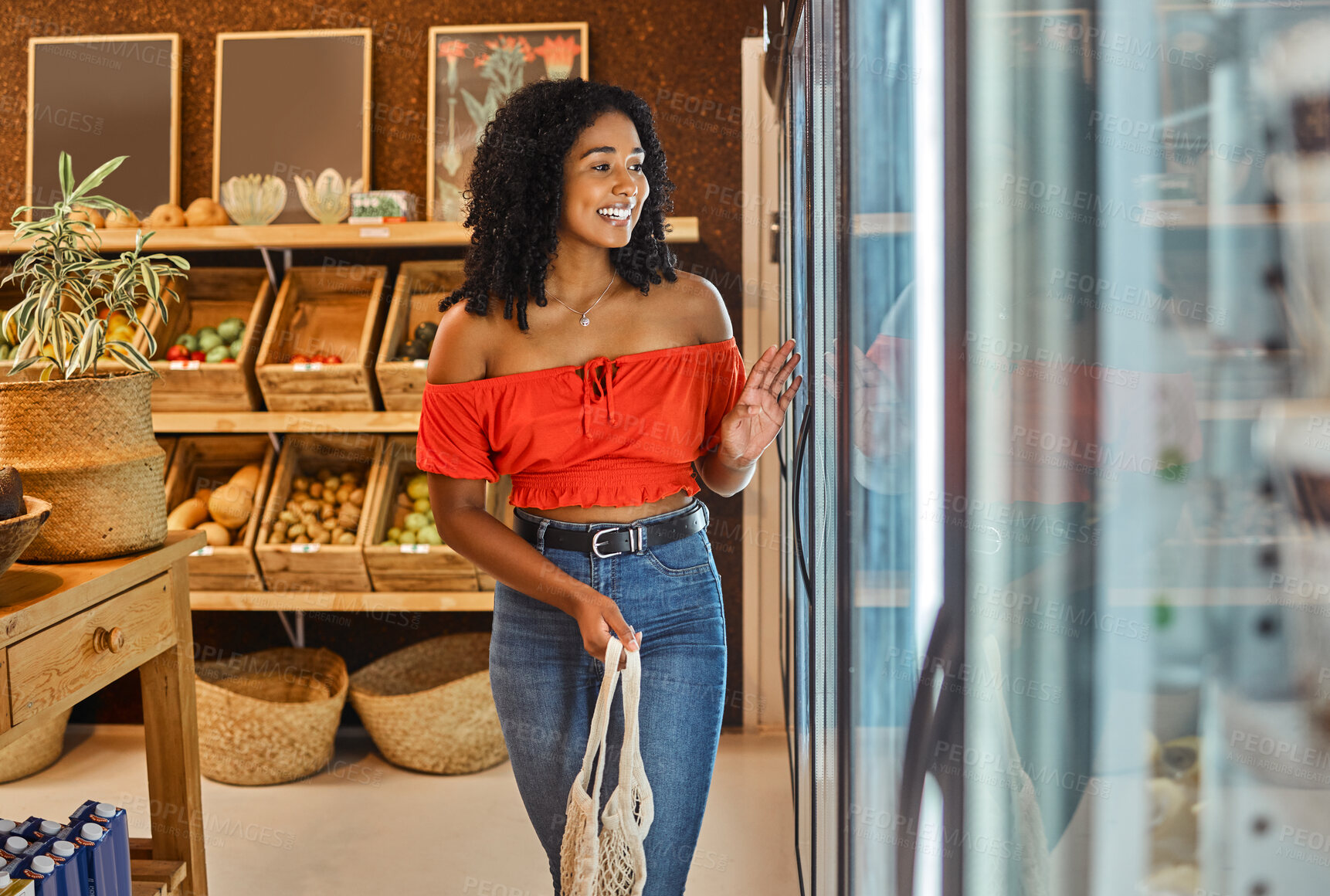 Buy stock photo Black woman, grocery shopping and supermarket, customer and food, smile by refrigerator and happy with retail discount. Young, cold storage product and organic with fresh groceries, sale and buy.