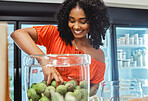 Black woman, grocery store and shopping, hand in jar and fruit to buy, customer and fresh product at local supermarket. Food, retail and sale, shop organic and young African American female in store.