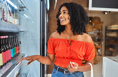 Buy stock photo Happy, grocery shopping and woman in a supermarket with drinks at a retail store in Sao Paulo. Happiness, smile and girl from Brazil buying a beverage on a shelf in a food shop while on vacation.