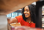Shelf, store and shopping black woman in grocery shop, choice or select food products. Retail, supermarket and female customer from Nigeria choosing goods in small business, market or grocery store.