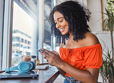 Buy stock photo Coffee shop, black woman and phone while happy, excited and typing on phone for communication app with cafe wifi. Freelancer female on internet to blog, social media and do remote work on internet