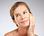 Cosmetics, senior woman and natural beauty with organic facial, wellness and health for skincare with studio background. Elderly female, mature lady or makeup for smooth skin, face glow or body care 