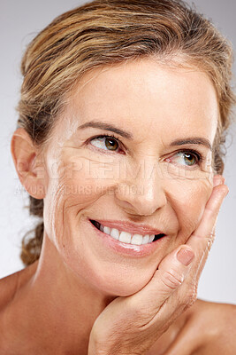 Buy stock photo Senior woman, beauty and skincare with smile for facial cosmetics, makeup or treatment against a grey studio background. Happy elderly female face relaxing and smiling in happiness for perfect skin