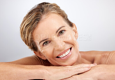 Buy stock photo Senior woman, relax and beauty for skincare with smile for cosmetics, facial or treatment against a grey studio background. Portrait of happy elderly female face relaxing and smiling for moisturizer