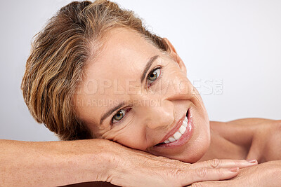 Buy stock photo Skincare, smile and face of a mature woman at a spa for healthcare and wellness against a grey studio background. Portrait of a happy, beauty and senior cosmetics model with peace for clean skin
