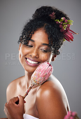 Buy stock photo Black woman, beauty and flower, skin and skincare, natural cosmetic advertising with floral design in studio background. Hair care, face treatment and makeup marketing mockup, model and smile.