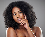 Face, beauty and idea with a model black woman thinking about skincare in studio on a gray background. Cosmetic, mindset and natural hair with an attractive young female posing for health or wellness