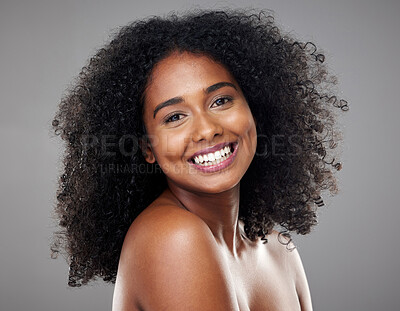 Buy stock photo Black woman, makeup and beauty with hair, cosmetic and smile with afro, face and happiness. Model, happy and skincare with cosmetics, shine or glow on skin for hair care, wellness or health in studio