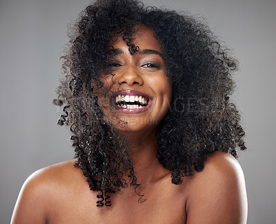 Buy stock photo Face, hair care and beauty smile of black woman on gray studio background. Portrait, makeup and female model from Jamaica with beautiful, healthy head of hair and curls after spa cosmetics treatment
