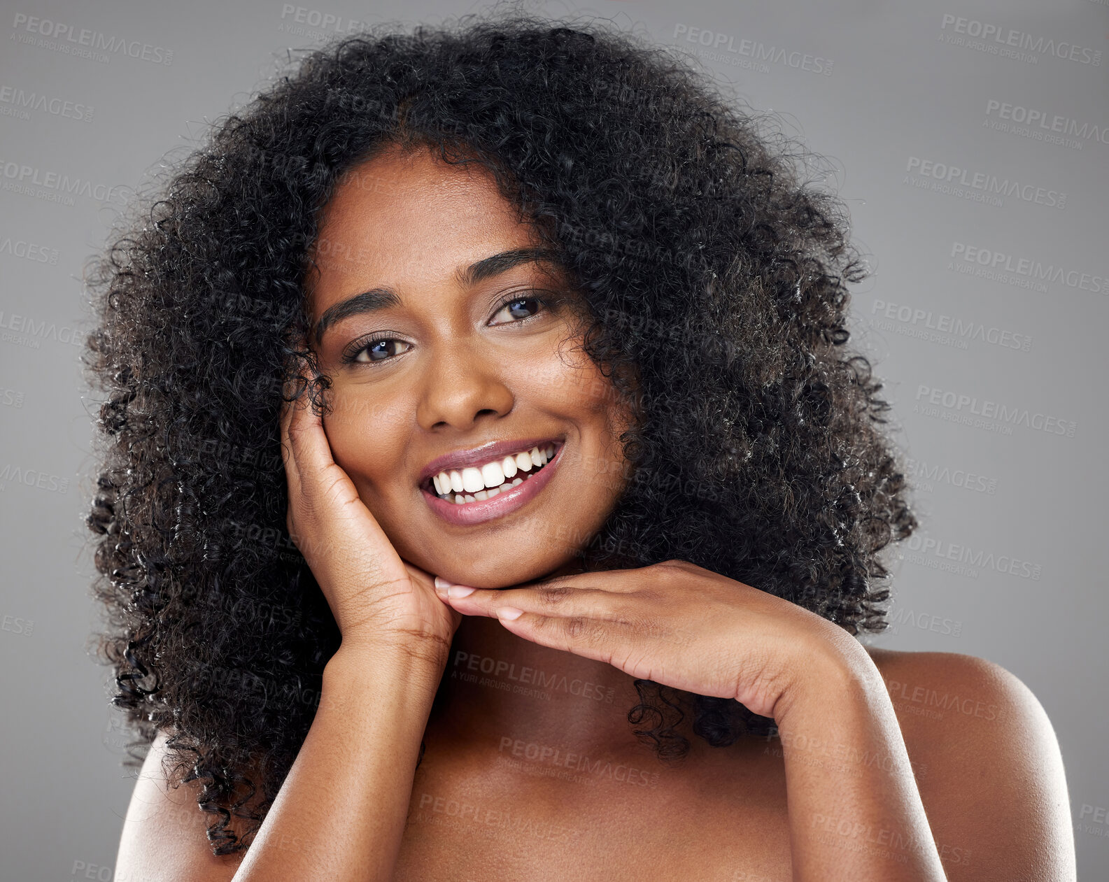 Buy stock photo Black woman afro, beauty and smile for skincare, cosmetics or treatment against a grey studio background. Portrait of happy isolated African female smiling with teeth satisfied for perfect skin
