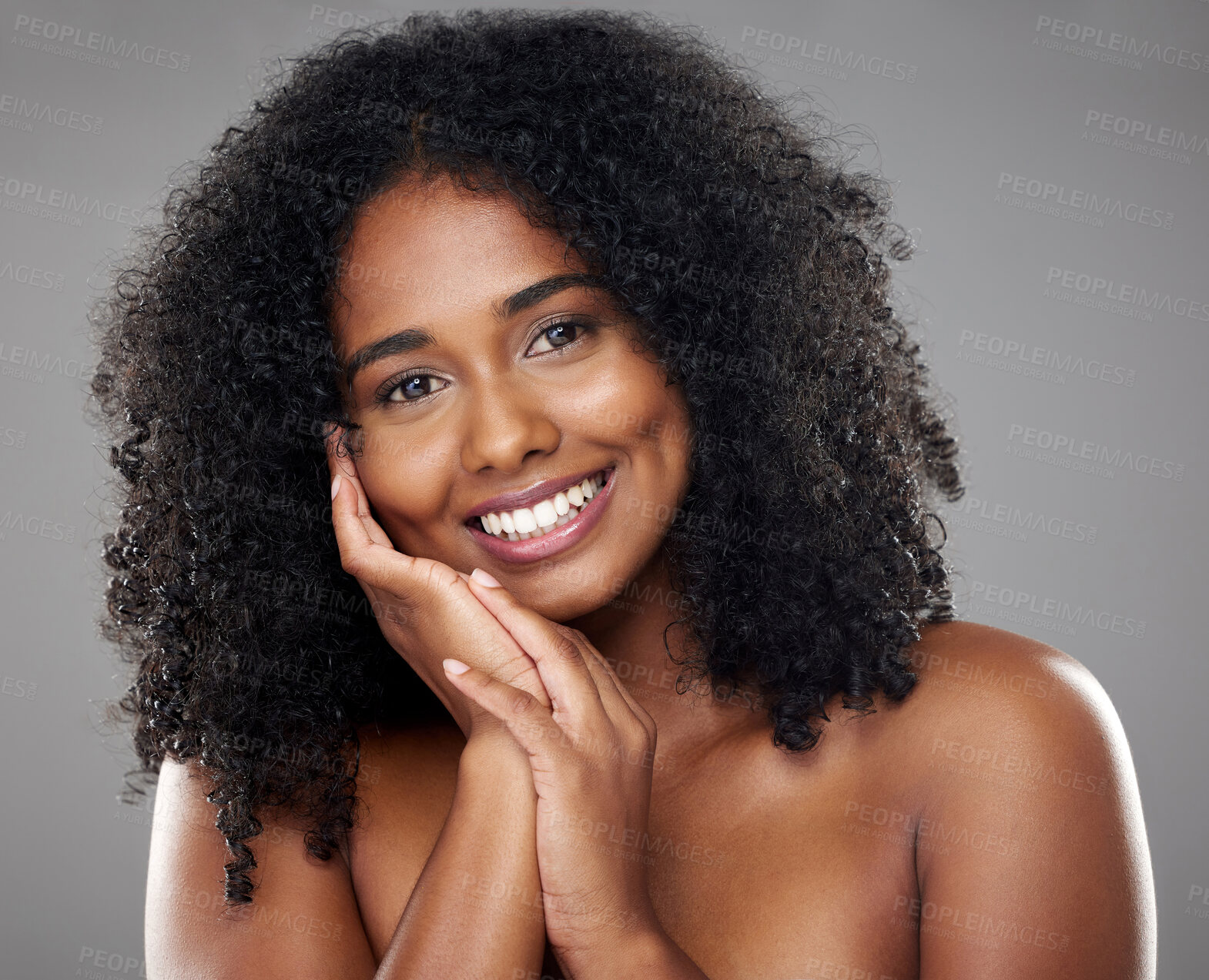 Buy stock photo Black woman, beauty and hand on face, portrait and isolated on gray studio background. Makeup, cosmetics and female model from South Africa with healthy, beautiful and flawless skin or natural hair.
