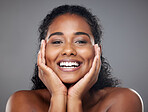 Beauty, indian woman and happy face, skin or natural makeup, glowing skincare and clean cosmetics on grey studio background. Smile young female model face, smile or healthy facial wellness or health
