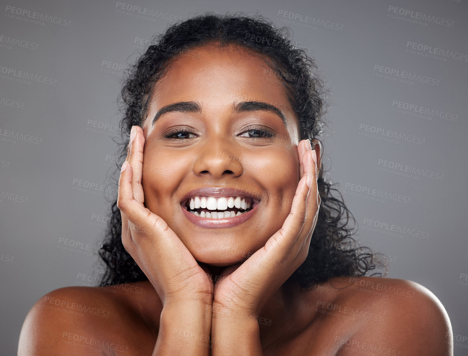 Buy stock photo Beauty, indian woman and happy face, skin or natural makeup, glowing skincare and clean cosmetics on grey studio background. Smile young female model face or healthy luxury facial wellness or health
