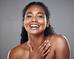 Skincare, beauty and portrait of a happy woman in a studio with a cosmetic makeup routine. Happiness, facial and natural face of a young model with a smile from Mexico isolated by a gray background.