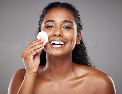 Buy stock photo Skincare, beauty and portrait of black woman with cotton pad to cleanse face. Beauty products, facial and girl clean makeup, cosmetics and skincare products for healthy skin, wellness and body care