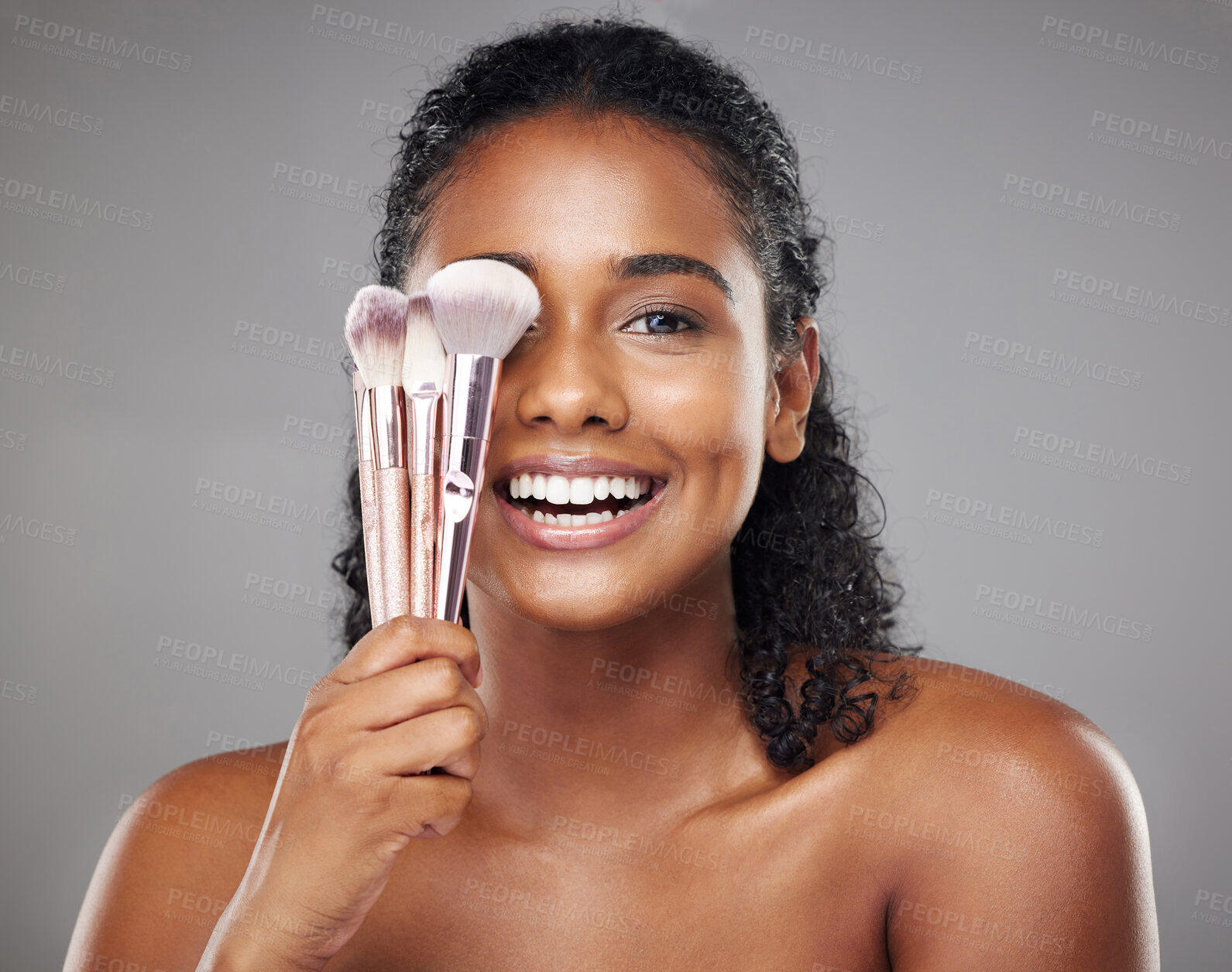 Buy stock photo Makeup, beauty and portrait of woman with brush to apply foundation, skincare product or luxury facial cosmetics. Wellness, health and happy aesthetic face of model girl isolated on gray background