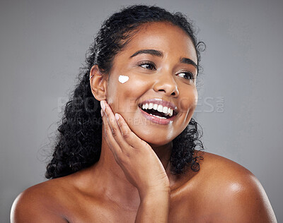 Buy stock photo Cosmetics, black woman and cream with smile, wellness and health for natural beauty, happy and grey studio background. Makeup, healthy girl and skincare for organic facial, smooth skin and body care.