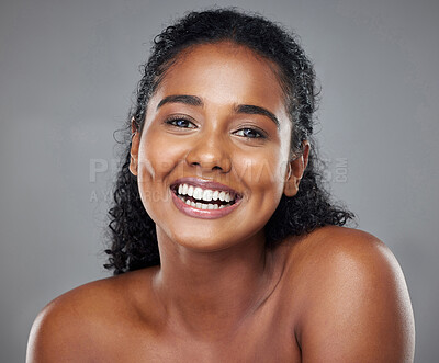 Buy stock photo Black woman, beauty and smile with teeth for skincare, makeup or cosmetics against a grey studio background. Portrait of happy African American model smiling in satisfaction for dental treatment