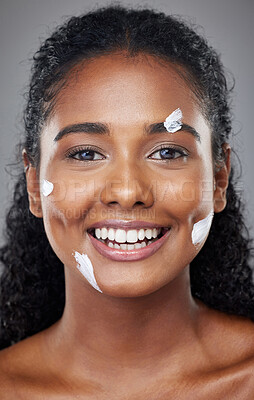 Buy stock photo Black woman, beauty and facial skincare moisturizer, cream or lotion with smile for cosmetics against grey studio background. Portrait of happy African American female face smiling for skin treatment