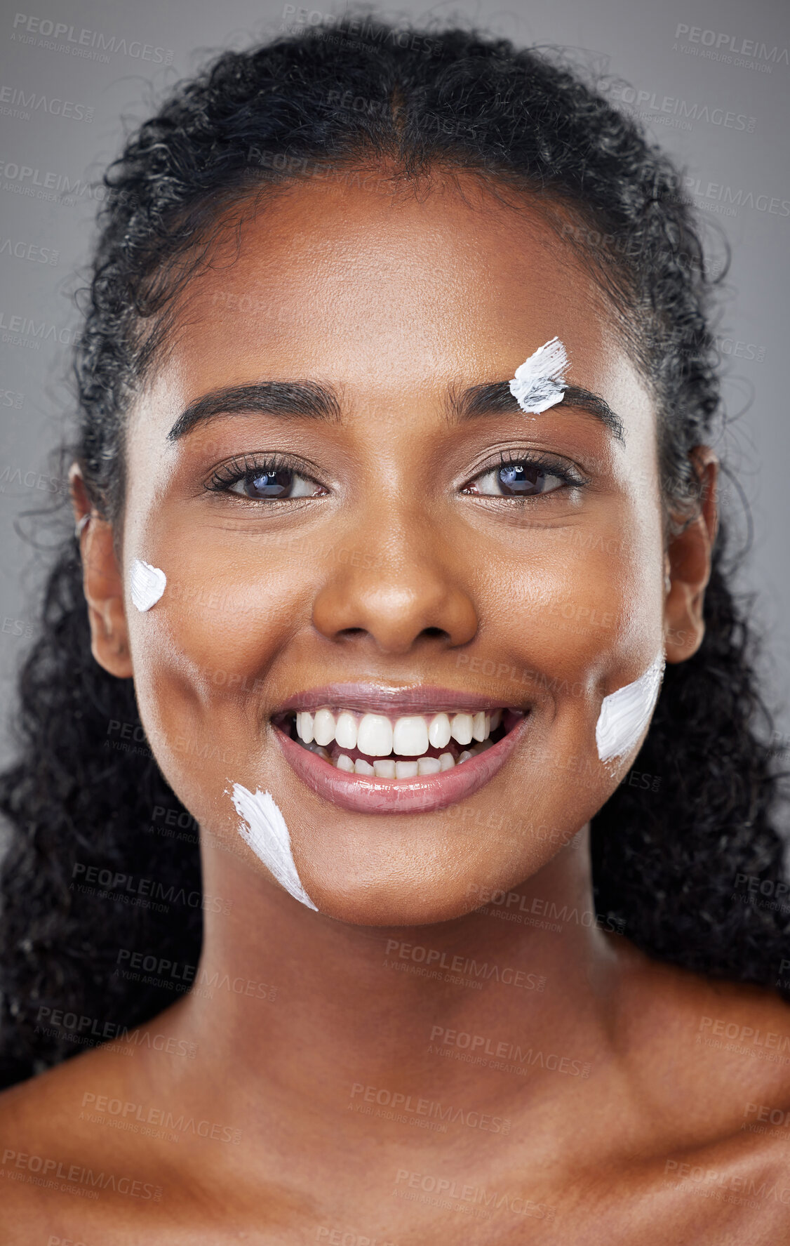 Buy stock photo Black woman, beauty and facial skincare moisturizer, cream or lotion with smile for cosmetics against grey studio background. Portrait of happy African American female face smiling for skin treatment