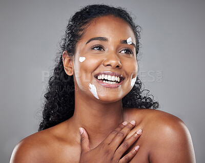 Buy stock photo Skincare, beauty and face cream by black woman in studio mockup for wellness, hygiene and grooming. Black woman, facial and skin health by model smile, relax and enjoy treatment on grey background