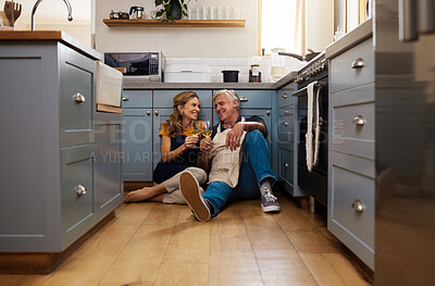 Buy stock photo Couple, senior and wine in kitchen, floor and wood for romance, bonding or love in home for happiness. Elderly, man and woman make toast, happy or smile for glass, drinking and together on flooring