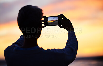 Buy stock photo Man silhouette, smartphone and beach sunset photograph for social media post. Young photographer man, vacation travel adventure or holiday freedom trip by ocean sea memory on mobile technology app