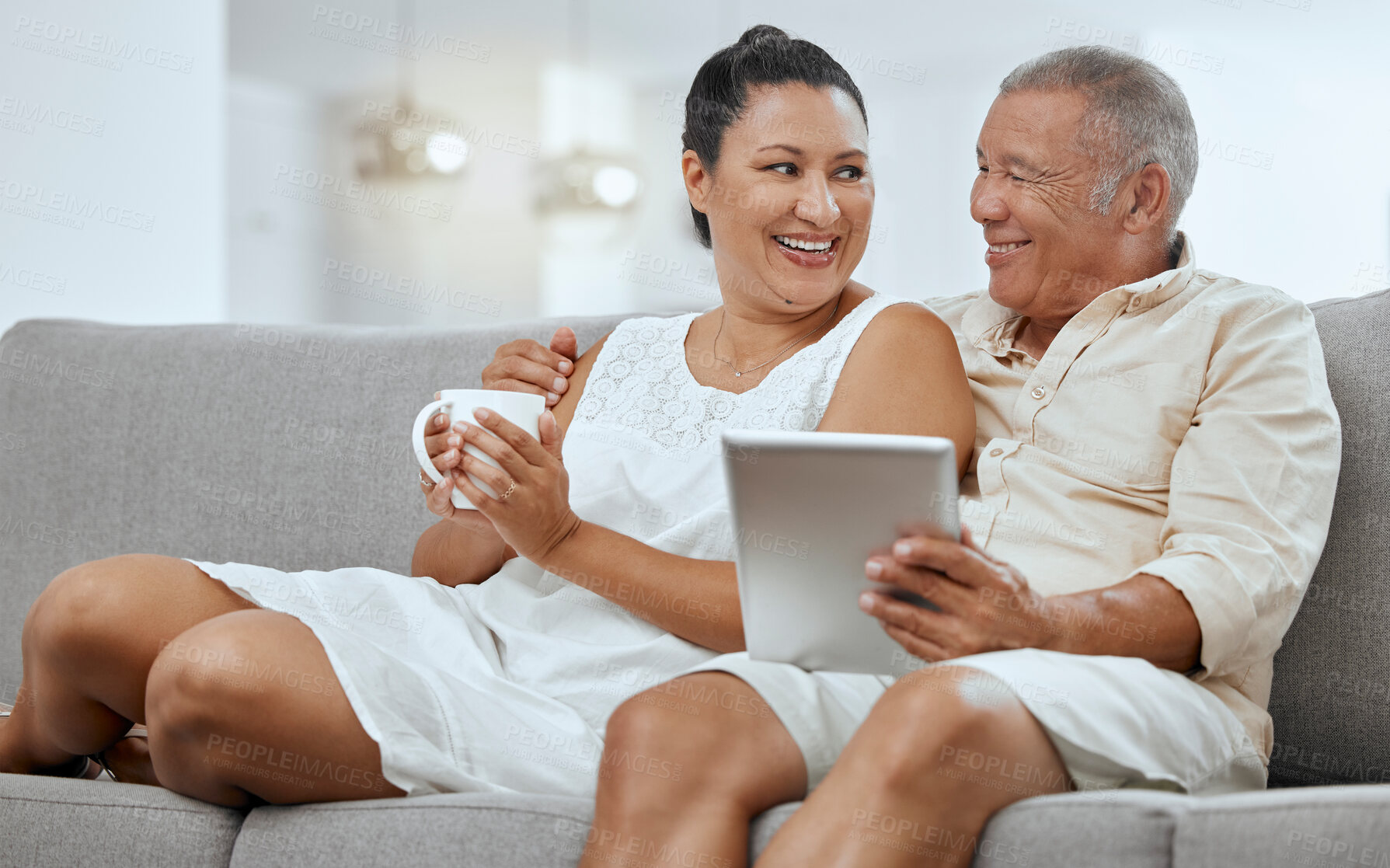 Buy stock photo Love, senior couple and tablet to scroll online, being happy and smile together on living room sofa. Romance, man and woman with digital device for bonding, anniversary and marriage or relax on couch